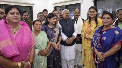 Bihar chief minister Nitish Kumar with newly sworn-in cabinet ministers in Patna. (PTI)