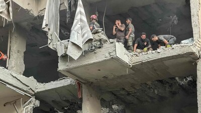 Rescuers search for survivors at the site of an Israeli air attack that targeted a residential building in Beirut's southern Haret Hreik neighbourhood on November 23, 2025. (AFP) Rescuers search for survivors at the site of an Israeli air attack that targeted a residential building in Beirut's southern Haret Hreik neighbourhood on November 23, 2025. (AFP)