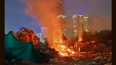 Illegally dumped garbage set on fire near Sector 81 in Gurugram last month. (HT Photo)
