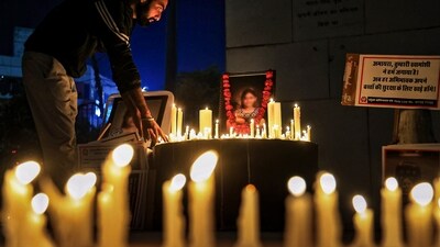 A man pays tributes to nine-year-old girl during a candle march, in Jaipur. The girl died after jumping from the fourth floor of her school on November 1. (PTI) A man pays tributes to nine-year-old girl during a candle march, in Jaipur. The girl died after jumping from the fourth floor of her school on November 1. (PTI)