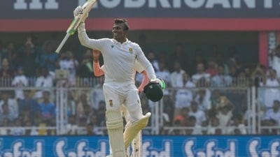 Left-hander Senuran Muthusamy scored 109 and shared a valuable 97-run stand for the eighth wicket with Marco Jansen, who fell as the final dismissal in the last session in Guwahati. (PTI) Left-hander Senuran Muthusamy scored 109 and shared a valuable 97-run stand for the eighth wicket with Marco Jansen, who fell as the final dismissal in the last session in Guwahati. (PTI)