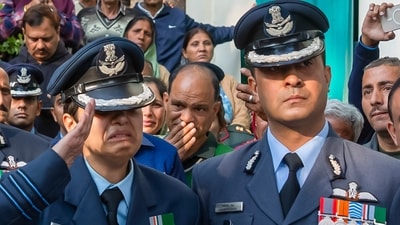 Wing Commander Afshan Akhtar, wife of Indian Air Force (IAF) Wing Commander Namansh Syal, salutes as his mortal remains are being brought to his ancestral home. (PTI)