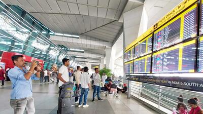 Passengers wait outside the departure terminal at Indira Gandhi International (IGI) Airport on November 7 when the glitch took place (Sanjeev Verma/HT Photo)