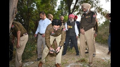 SSP Varun Sharma, along with other officials, at the site of the encounter in Patiala on Sunday. (HT)
