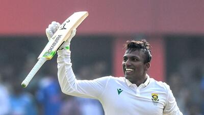 South Africa's Senuran Muthusamy celebrates after scoring a century on Day 2 of the second Test against India. (AFP) South Africa's Senuran Muthusamy celebrates after scoring a century on Day 2 of the second Test against India. (AFP)