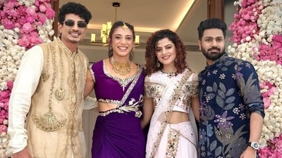 Smriti Mandhana and Palash Muchhal pose during their mehndi ceremony with Palash's sister, Palak Muchhal and Mithoon. Smriti Mandhana and Palash Muchhal pose during their mehndi ceremony with Palash's sister, Palak Muchhal and Mithoon.