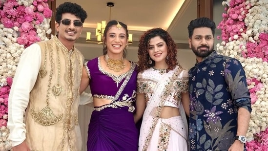 Smriti Mandhana and Palash Muchhal pose during their mehndi ceremony with Palash's sister, Palak Muchhal and Mithoon.
