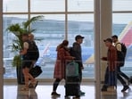 Travelers make their way through William P. Hobby Airport on Monday, Nov. 24, 2025, in Houston. (AP Photo/Ashley Landis)
