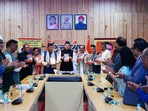 Uttarakhand Chief Minister Pushkar Singh Dhami, along with former chief ministers and other dignitaries, holds copies of senior journalist Jai Singh Rawat’s book “Uttarakhand Rajya ka Naveen Rajnitik Itihaas” during its release in Dehradun. Uttarakhand Chief Minister Pushkar Singh Dhami, along with former chief ministers and other dignitaries, holds copies of senior journalist Jai Singh Rawat’s book “Uttarakhand Rajya ka Naveen Rajnitik Itihaas” during its release in Dehradun.