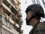 People inspect a damaged building, after Israeli military said on Sunday that it struck a militant from the Lebanese Iran-aligned Hezbollah group, in Beirut's southern suburbs, Lebanon 