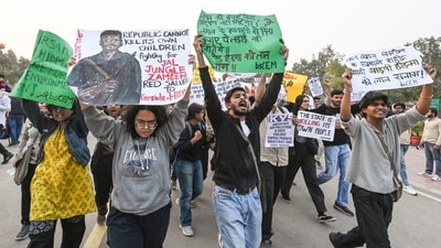 People seen marching with posters at Delhi's India Gate to stage a protest against rising air pollution in Delhi NCR (ANI) People seen marching with posters at Delhi's India Gate to stage a protest against rising air pollution in Delhi NCR (ANI)