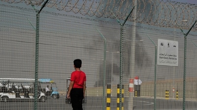 A bystander watches as an Indian HAL Tejas crashes during a demonstration at the Dubai Air Show, at Al Maktoum International Airport at Dubai World Central (AP) A bystander watches as an Indian HAL Tejas crashes during a demonstration at the Dubai Air Show, at Al Maktoum International Airport at Dubai World Central (AP)
