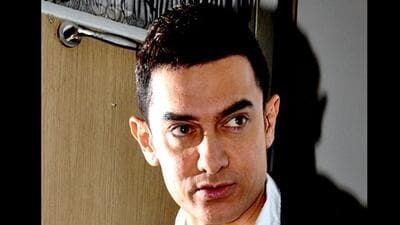 Actor Aamir Khan was conferred first-ever RK Laxman Award for excellence at AR Rahman live concert held at MCA Cricket Stadium, Gahunje, on Sunday. (HT)