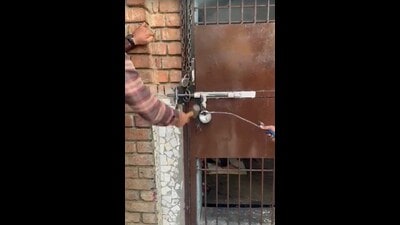 Police breaking open the locks of the de-addiction centre in Ludhiana on Monday. (HT Photo)