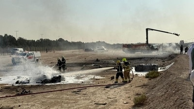Firefighters work at the site of a crash involving an Indian-made HAL Tejas fighter jet at the Dubai Air Show, United Arab Emirates, November 21, 2025, (Reuters)