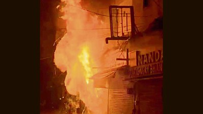 The shop in flames in Ludhiana on Sunday night. (HT Photo)