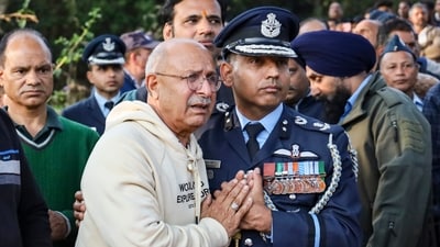 Father of Indian Air Force (IAF) Wing Commander Namansh Syal, who was killed during an aerial display at the Dubai Air show, mourns as his mortal remains are being brought at his ancestral home for the last rites. (PTI)