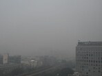 A thick layer of haze engulfed the MG road in Gurugram on Tuesday. (Parveen Kumar/HT) A thick layer of haze engulfed the MG road in Gurugram on Tuesday. (Parveen Kumar/HT)