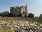 Garbage dumping seen in the empty land in Ardee City near Sector 52 in Gurugram on Tuesday. (Parveen Kumar/HT) Garbage dumping seen in the empty land in Ardee City near Sector 52 in Gurugram on Tuesday. (Parveen Kumar/HT)