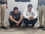 The arrested two suspects in police custody. The arrested two suspects in police custody.