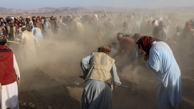 Afghan mourners and relatives of victims cover the graves with soil during a mass burial ceremony for nine children and one woman who were killed by a Pakistan air strike, in the Gurbuz district of Khost Province on November 25, 2025. (AFP) Afghan mourners and relatives of victims cover the graves with soil during a mass burial ceremony for nine children and one woman who were killed by a Pakistan air strike, in the Gurbuz district of Khost Province on November 25, 2025. (AFP)