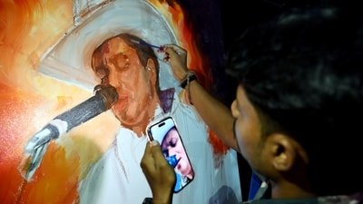 An Artist paints a portrait of late singer Zubeen Garg on his 53rd birth anniversary, organised by The Assam Pradesh Congress Committee (APCC), in Guwahati on Tuesday. (Photo for representation) (ANI ) An Artist paints a portrait of late singer Zubeen Garg on his 53rd birth anniversary, organised by The Assam Pradesh Congress Committee (APCC), in Guwahati on Tuesday. (Photo for representation) (ANI )