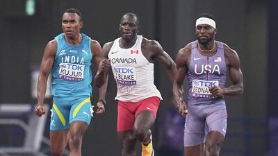 Animesh Kujur, left, Canada's Jerome Blake, center, and US' Kenneth Bednarek compete in 200m heat at the World C’ships. (AP) Animesh Kujur, left, Canada's Jerome Blake, center, and US' Kenneth Bednarek compete in 200m heat at the World C’ships. (AP)