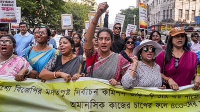 Kolkata: Booth-level officers who are engaged in the ongoing special intensive revision (SIR) of electoral rolls in West Bengal raise slogans during a protest march to the office of the Chief Electoral Officer in Kolkata, Monday, Nov. 24, 2025. (PTI) Kolkata: Booth-level officers who are engaged in the ongoing special intensive revision (SIR) of electoral rolls in West Bengal raise slogans during a protest march to the office of the Chief Electoral Officer in Kolkata, Monday, Nov. 24, 2025. (PTI)