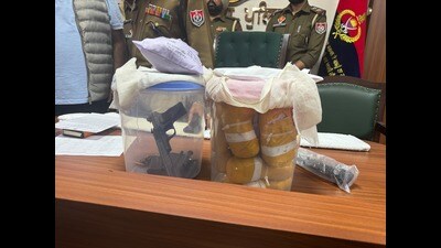 Drugs and weapons recovered by the BSF near Pak border on Tuesday. (HT Photo)