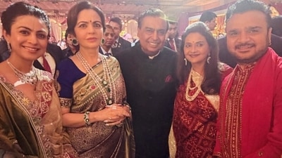 Nita Ambani and Mukesh Ambani at a wedding. Nita Ambani and Mukesh Ambani at a wedding.