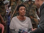 Honorine Porsche, a German woman prosecuted by the Congolese courts after attempting to rob a bank, looks on during a court apparence in Kinshasa on October 24, 2025. Honorine Porsche, a German woman prosecuted by the Congolese courts after attempting to rob a bank, looks on during a court apparence in Kinshasa on October 24, 2025.