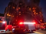 Firefighters try to extinguish a fire that broke out at Wang Fuk Court, a residential estate in the Tai Po district of Hong Kong's New Territories, on Wednesday, November 26, 2025. 