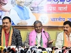 Jharkhand BJP chief Babulal Marandi (centre) at a press meet in Ranchi (ANI FILE)