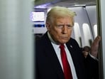  Donald Trump looks on aboard Air Force One during travel to Palm Beach, Florida