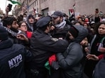 More than 2,000 people have been arrested for holding signs in support of the group.