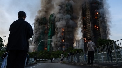 Smoke rises after a fire broke out at Wang Fuk Court, a residential estate in the Tai Po district of Hong Kong's New Territories on Wednesday, Nov. 26 2025. ((AP Photo/Chan Long Hei)) Smoke rises after a fire broke out at Wang Fuk Court, a residential estate in the Tai Po district of Hong Kong's New Territories on Wednesday, Nov. 26 2025. ((AP Photo/Chan Long Hei))