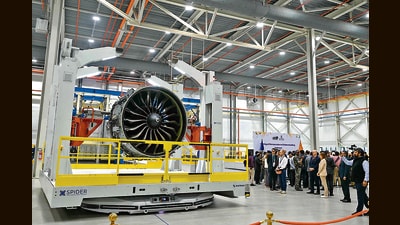 Dignitaries look at a CFM LEAP-1A engine after Safran Aircraft Engine Services' inauguration at GMR Aeropark in Hyderabad on November 26. (AFP)