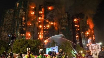 Videos circulating online showed smoke billowing into the sky from the residential buildings, where bamboo scaffolding appeared to have caught fire. (Bloomberg) Videos circulating online showed smoke billowing into the sky from the residential buildings, where bamboo scaffolding appeared to have caught fire. (Bloomberg)