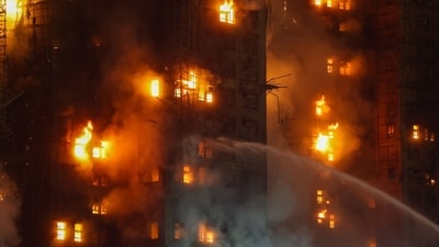 Firefighters tackle a fire engulfing residential buildings at Wang Fuk Court in the Tai Po district of Hong Kong, China, on Wednesday, Nov. 26, 2025. (Bloomberg) Firefighters tackle a fire engulfing residential buildings at Wang Fuk Court in the Tai Po district of Hong Kong, China, on Wednesday, Nov. 26, 2025. (Bloomberg)