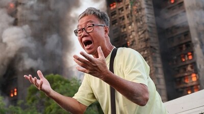 Wong 71, reacts after claiming his wife is trapped inside Wang Fuk Court during a major fire, in Tai Po, Hong Kong, China. (REUTERS)