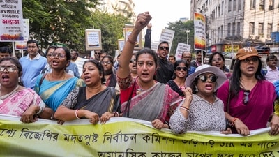 Some booth-level officers (BLOs) engaged in the ongoing Special Intensive Revision (SIR) of electoral rolls in West Bengal raise slogans during a protest march to the office of the Chief Electoral Officer (CEO) over alleged excessive work pressure, in Kolkata on November 24, 2025. (PTI) Some booth-level officers (BLOs) engaged in the ongoing Special Intensive Revision (SIR) of electoral rolls in West Bengal raise slogans during a protest march to the office of the Chief Electoral Officer (CEO) over alleged excessive work pressure, in Kolkata on November 24, 2025. (PTI)