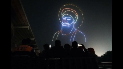 People watch a 'drone show' organised at Anandpur Sahib dedicated to the 350th martyrdom day in Rupnagar on Monday. (ANI) People watch a 'drone show' organised at Anandpur Sahib dedicated to the 350th martyrdom day in Rupnagar on Monday. (ANI)