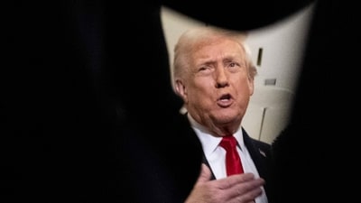 US President Donald Trump speaks to journalists aboard Air Force One. (Jim Watson/AFP Photo) US President Donald Trump speaks to journalists aboard Air Force One. (Jim Watson/AFP Photo)