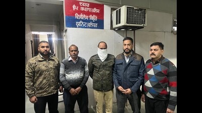 The accused ASI Jaswinder Singh (face covered) in VB custody. The accused ASI Jaswinder Singh (face covered) in VB custody.