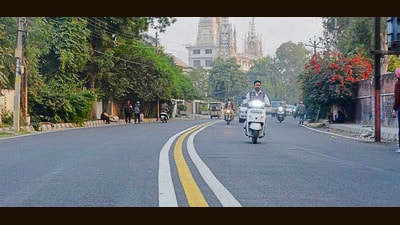 Three parallel markings—one yellow and two white—across the entire stretch on Basant Singh Khalsa Road in Ludhiana on Wednesday. (Manish/HT) Three parallel markings—one yellow and two white—across the entire stretch on Basant Singh Khalsa Road in Ludhiana on Wednesday. (Manish/HT)