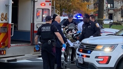 An unidentified man in military fatigues lies on a stretcher and is wheeled to a waiting ambulance on November 26, 2025 in downtown Washington, DC. (AFP) An unidentified man in military fatigues lies on a stretcher and is wheeled to a waiting ambulance on November 26, 2025 in downtown Washington, DC. (AFP)