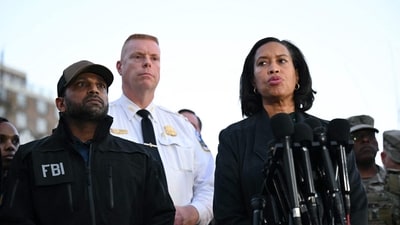 FBI Director Kash Patel (L), Jeffery Carroll (C) Executive Assistant Chief of Police at the Metropolitan Police Department (MPD) listen to District of Columbia mayor Muriel Bowser speak during a press conference after a shooting in downtown Washington, on November 26, 2025. (AFP) FBI Director Kash Patel (L), Jeffery Carroll (C) Executive Assistant Chief of Police at the Metropolitan Police Department (MPD) listen to District of Columbia mayor Muriel Bowser speak during a press conference after a shooting in downtown Washington, on November 26, 2025. (AFP)