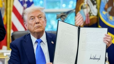 President Donald Trump holds a signed executive order in the Oval Office of the White House, Sept. 19. President Donald Trump holds a signed executive order in the Oval Office of the White House, Sept. 19.