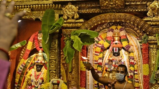 Hindu devotees visit the Tirumala Tirupati Devasthanams temple on the occasion of 'Ugadi' festival or new year's day as per the Hindu lunisolar calendar in Chennai on April 13, 2021. (Photo by Arun SANKAR / AFP) (AFP)