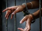 Woman booked for trapping, threatening, and extorting man